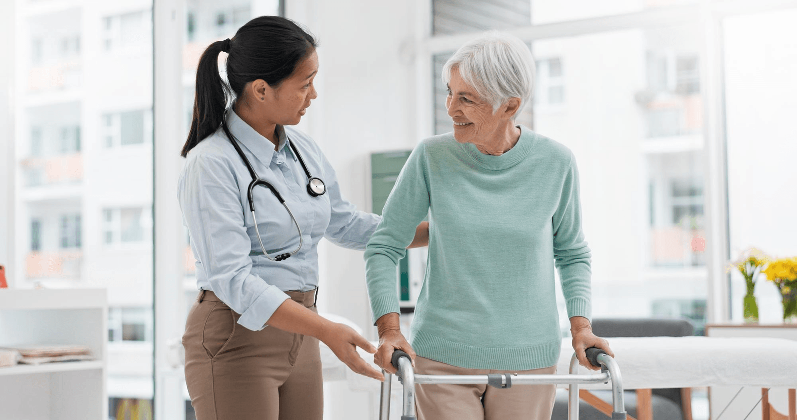 A nurse supporting an older adult patient